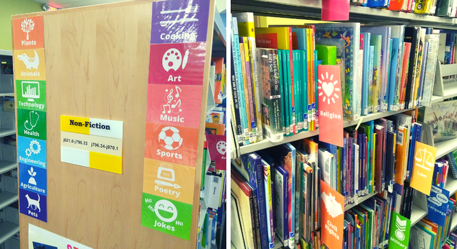 The non-fiction shelves in the children's department with rainbow subject labels